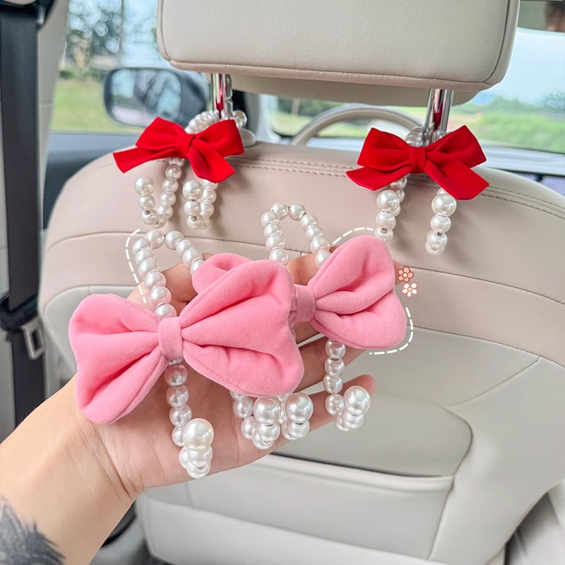 車の後部座席用の白い真珠のフック,かわいい蝶ネクタイハンガー - Car Accessories Hanging のレビューと価格